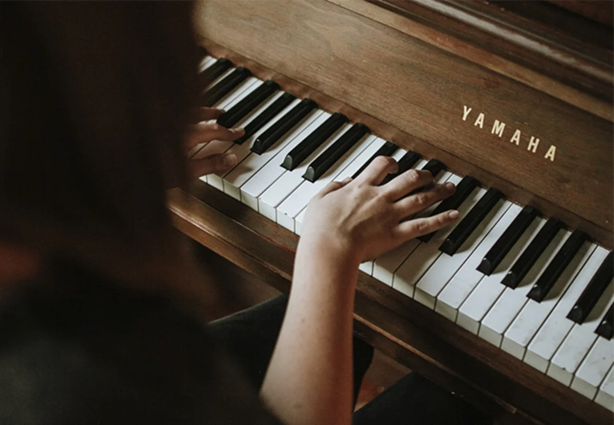 Photo of a girl playing the piano